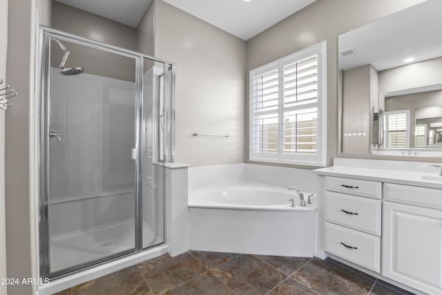 bathroom with vanity and plus walk in shower