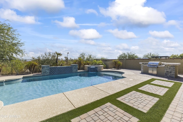 view of swimming pool featuring a patio, an outdoor kitchen, a pool with connected hot tub, and fence