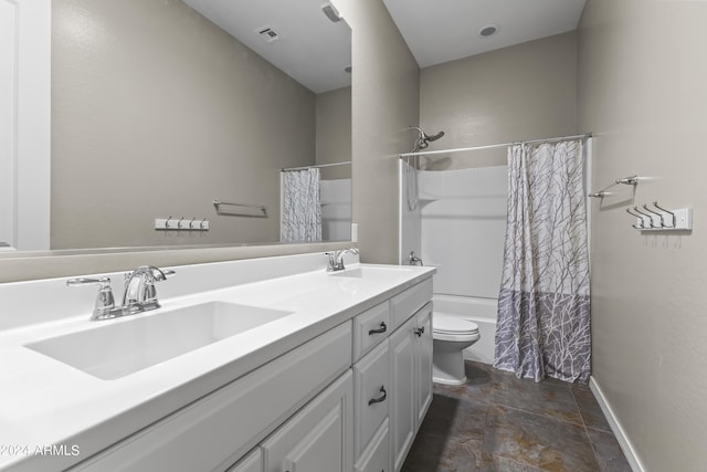 full bath featuring toilet, double vanity, a sink, and visible vents