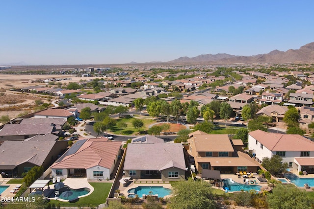 birds eye view of property featuring a mountain view