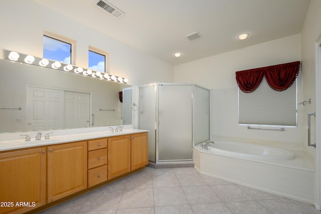 full bath with tile patterned floors, a bath, visible vents, and a sink