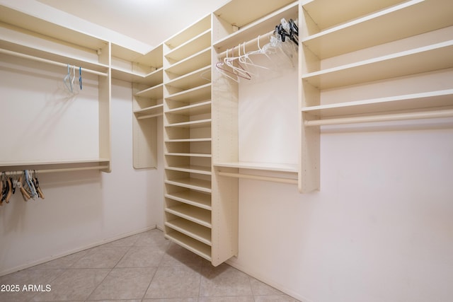 spacious closet with tile patterned flooring