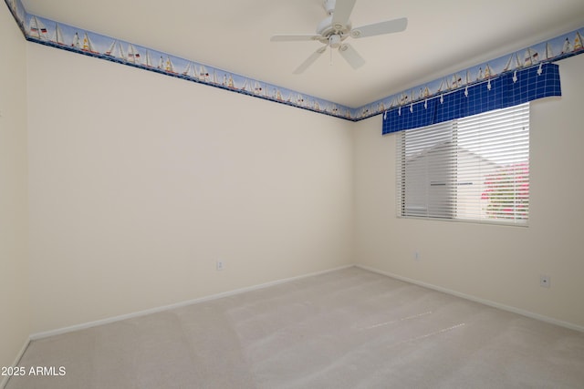 unfurnished room featuring carpet flooring, baseboards, and ceiling fan