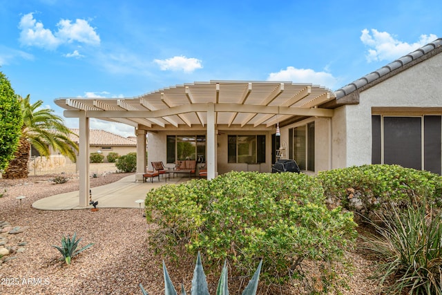 exterior space with a pergola and fence