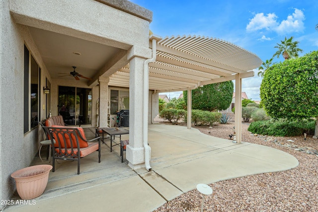 view of patio featuring ceiling fan and a pergola