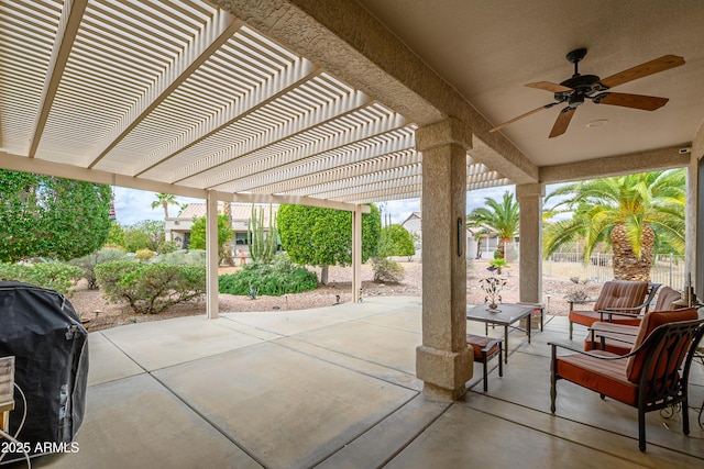 view of patio / terrace with area for grilling, fence, a pergola, and ceiling fan