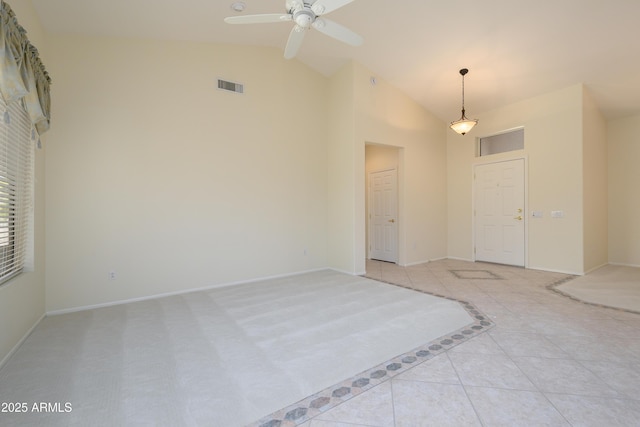 unfurnished room featuring visible vents, ceiling fan, baseboards, light tile patterned floors, and high vaulted ceiling