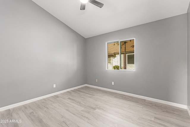 empty room with ceiling fan and light hardwood / wood-style floors