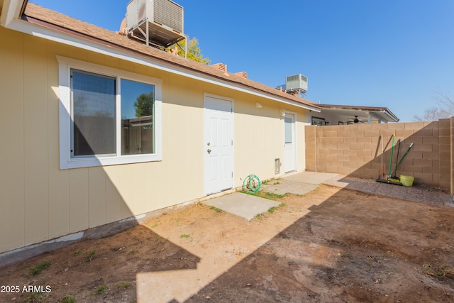 property entrance with central AC unit