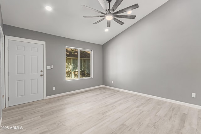 interior space with vaulted ceiling, ceiling fan, and light hardwood / wood-style flooring