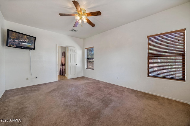 1970 Twin Pines Trl, Overgaard, AZ 85933 - unfurnished bedroom featuring carpet flooring and ceiling fan