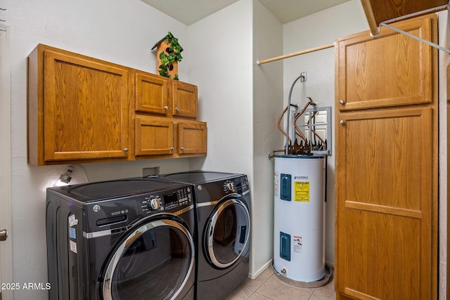 1970 Twin Pines Trl, Overgaard, AZ 85933 - laundry room with electric water heater, washing machine and dryer, cabinet space, and light tile patterned floors