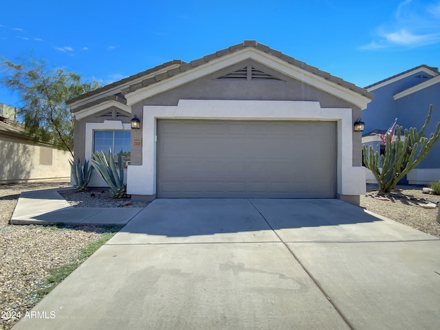 view of front of home with an outdoor structure and a garage