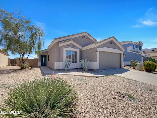 ranch-style home featuring a garage