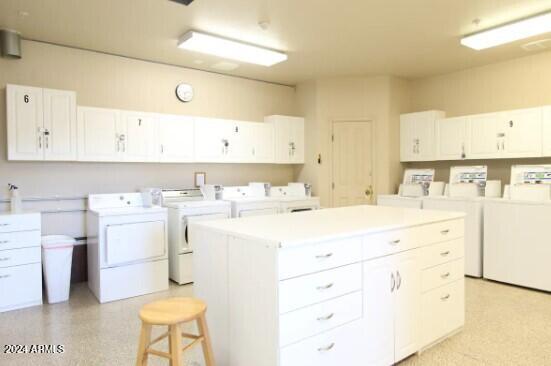 laundry room with independent washer and dryer