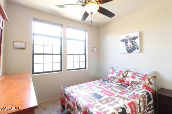 bedroom with carpet and ceiling fan