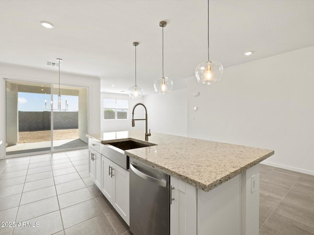 4041 S 176th Dr, Goodyear, AZ 85338 - kitchen featuring stainless steel dishwasher, a center island with sink, white cabinetry, light tile patterned floors, and hanging light fixtures