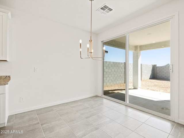 4041 S 176th Dr, Goodyear, AZ 85338 - unfurnished dining area with a chandelier and light tile patterned flooring