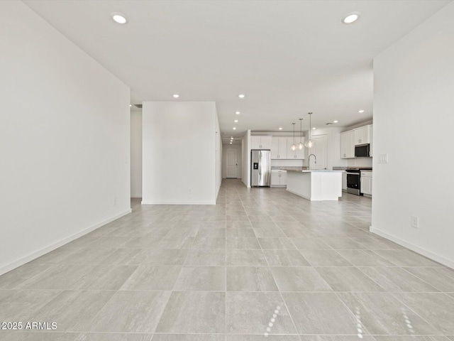 4041 S 176th Dr, Goodyear, AZ 85338 - unfurnished living room with recessed lighting and light tile patterned floors