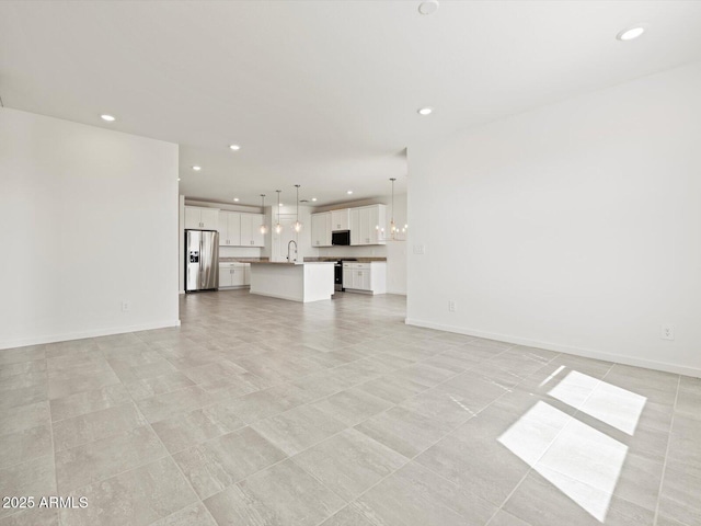 4041 S 176th Dr, Goodyear, AZ 85338 - unfurnished living room with recessed lighting and a chandelier