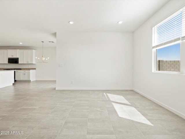 4041 S 176th Dr, Goodyear, AZ 85338 - unfurnished room featuring a chandelier, recessed lighting, and light tile patterned flooring