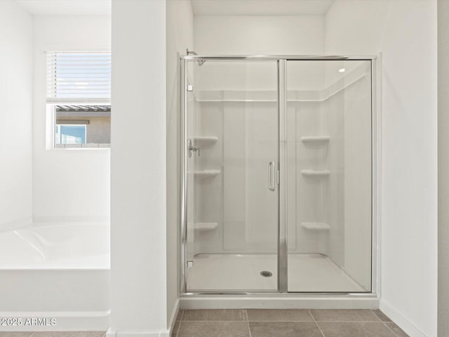 4041 S 176th Dr, Goodyear, AZ 85338 - bathroom featuring a shower stall, a garden tub, and tile patterned floors
