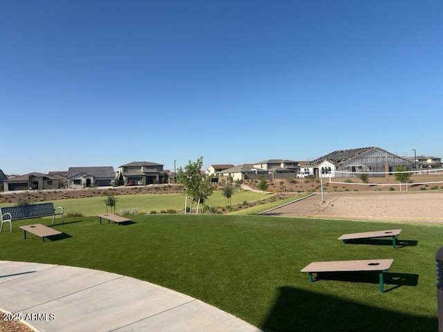 4041 S 176th Dr, Goodyear, AZ 85338 - view of community with volleyball court, a yard, and a residential view
