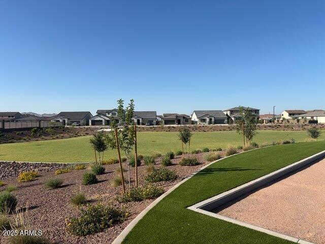 4041 S 176th Dr, Goodyear, AZ 85338 - view of property's community featuring a residential view and a yard