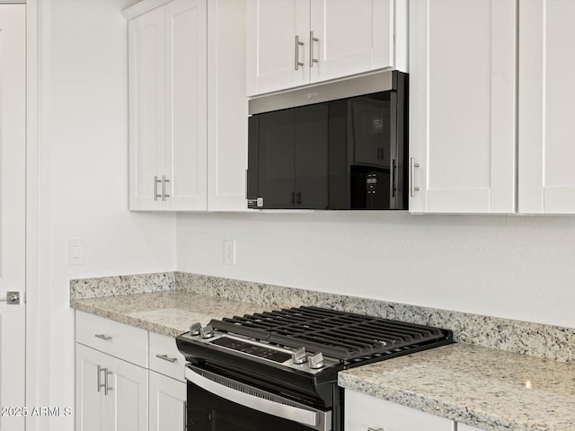 4041 S 176th Dr, Goodyear, AZ 85338 - kitchen featuring appliances with stainless steel finishes, white cabinets, and light stone counters