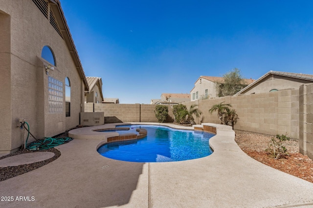 view of pool with a fenced backyard, a fenced in pool, a patio, and an in ground hot tub