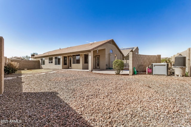 back of property featuring a patio area, a fenced backyard, and stucco siding