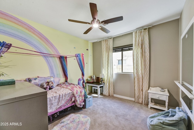 bedroom featuring a ceiling fan, light carpet, and baseboards