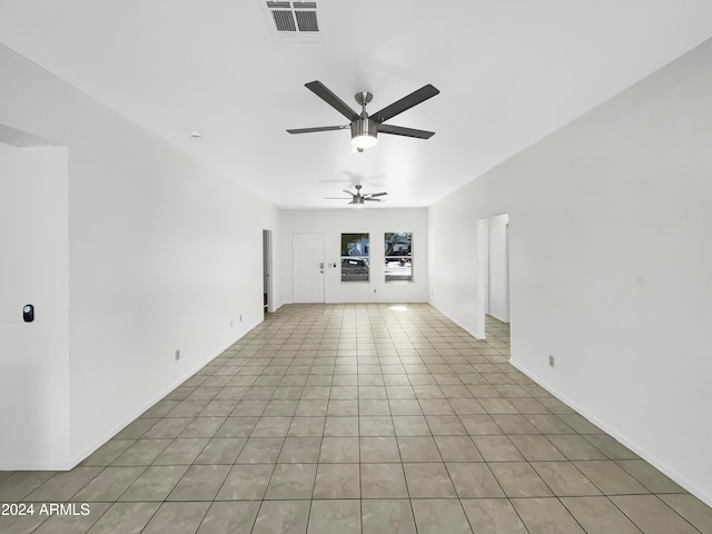 unfurnished living room with light tile patterned floors and ceiling fan