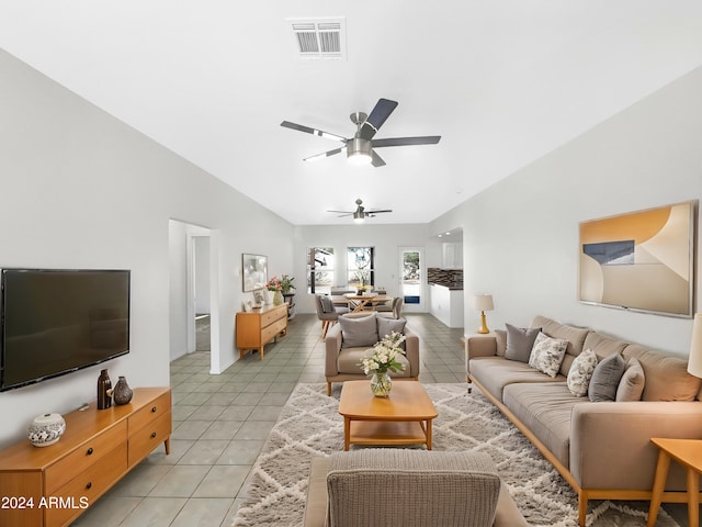 living room featuring light tile patterned floors and ceiling fan