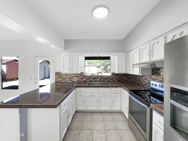 kitchen featuring appliances with stainless steel finishes, sink, and white cabinets