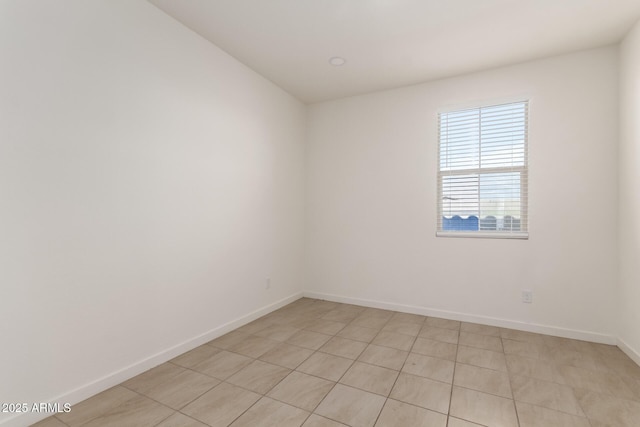 empty room featuring baseboards