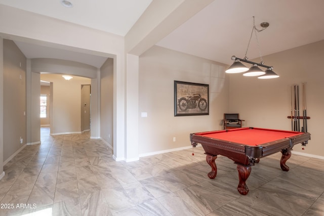 rec room featuring arched walkways, pool table, and baseboards