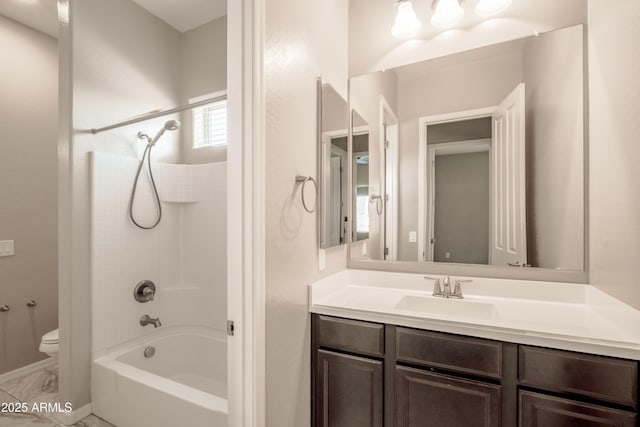 full bathroom with baseboards, toilet, shower / bathtub combination, marble finish floor, and vanity