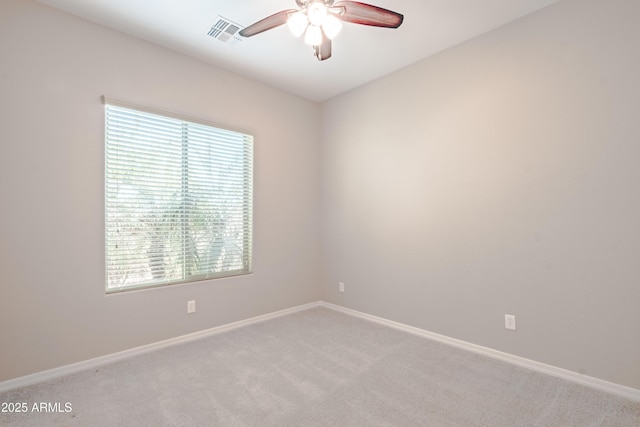 unfurnished room with ceiling fan, baseboards, visible vents, and light colored carpet