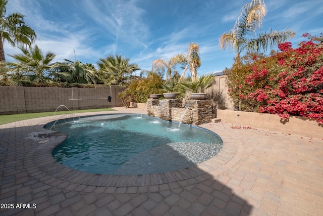 view of swimming pool featuring a patio, a fenced backyard, and a fenced in pool