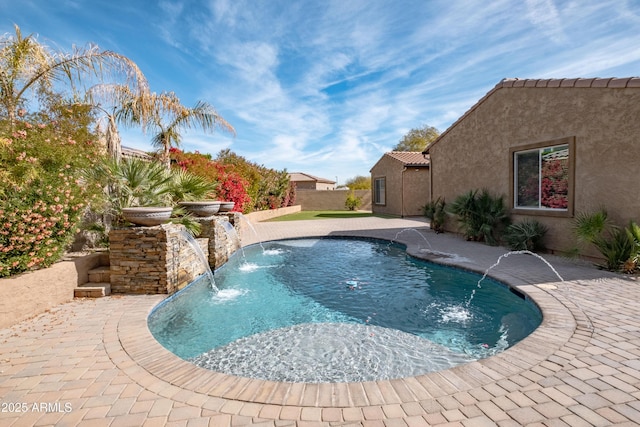 view of pool with a fenced in pool, a patio area, and fence