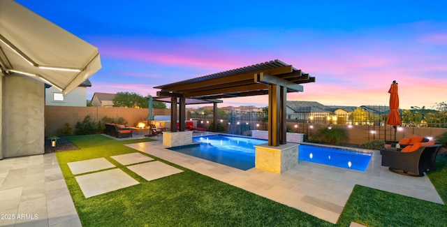 8149 E Jaeger St, Mesa, AZ 85207 - pool at dusk with a patio area and an outdoor living space