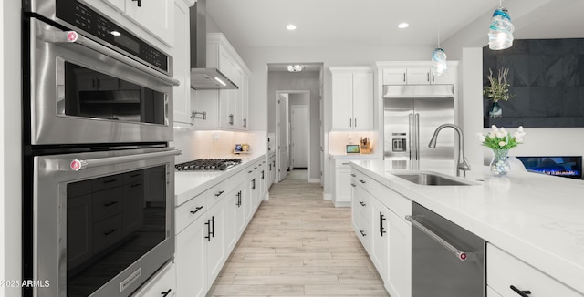 8149 E Jaeger St, Mesa, AZ 85207 - kitchen featuring appliances with stainless steel finishes, a sink, light wood-style flooring, white cabinetry, and recessed lighting