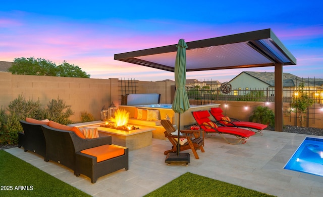 8149 E Jaeger St, Mesa, AZ 85207 - patio terrace at dusk featuring a fire pit and a fenced backyard