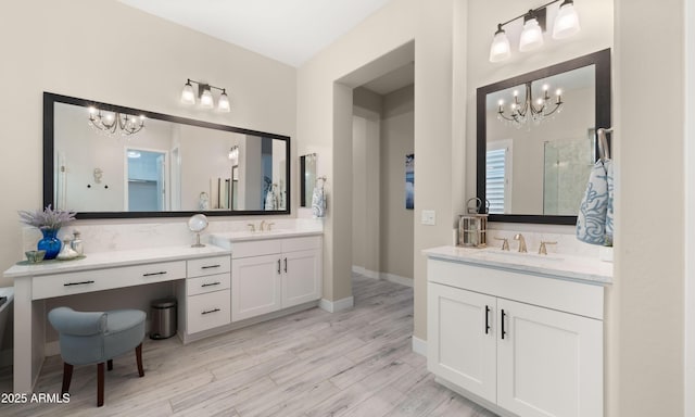 8149 E Jaeger St, Mesa, AZ 85207 - bathroom featuring a chandelier, wood finished floors, and two vanities