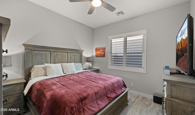 8149 E Jaeger St, Mesa, AZ 85207 - bedroom with wood finished floors, baseboards, and ceiling fan