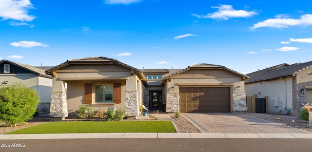 8149 E Jaeger St, Mesa, AZ 85207 - view of front facade featuring stucco siding, stone siding, a garage, driveway, and a front lawn