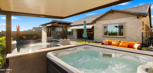8149 E Jaeger St, Mesa, AZ 85207 - back of house featuring a hot tub, fence, and stucco siding
