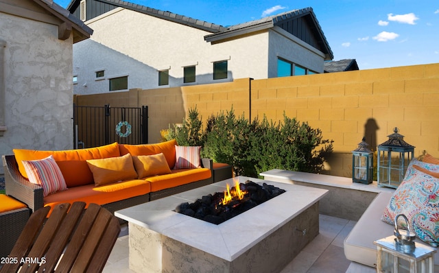 8149 E Jaeger St, Mesa, AZ 85207 - view of patio / terrace with an outdoor living space with a fire pit and fence
