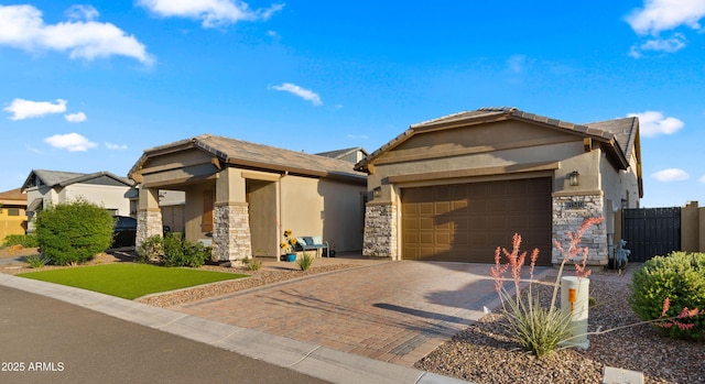 8149 E Jaeger St, Mesa, AZ 85207 - ranch-style home with stone siding, a garage, decorative driveway, and stucco siding